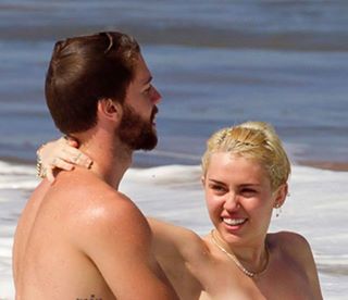 Miley Cyrus Frees Her Nipples While on Vacation in Hawaii with Boyfriend Patrick Schwarzenegger (NSFW Photo)
