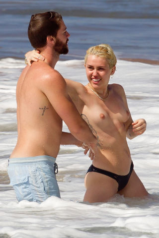 Miley Cyrus Frees Her Nipples While on Vacation in Hawaii with Boyfriend Patrick Schwarzenegger (NSFW Photo)